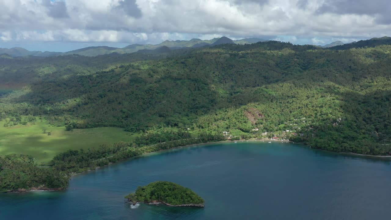 Aerial view overlooking the Bahia Carenero bay in Samana, Dominican Republic - reverse, drone shot