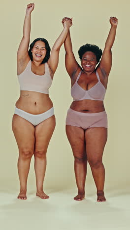 two women celebrating body positivity and friendship