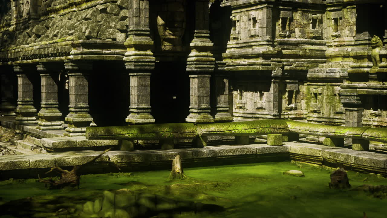Ancient khmer temple in cambodia with moss covered stones and serene water