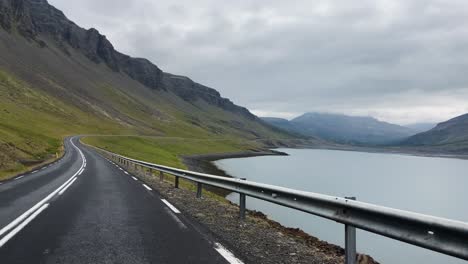 Driving-on-lake-coastline-in-Iceland,-POV