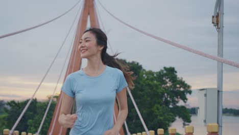 woman running on a bridge