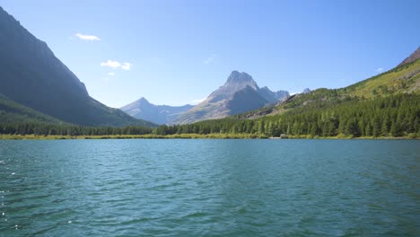 mount wilbur in glacier national park viewed from moving many glacier boat