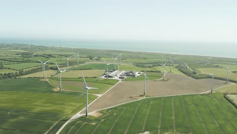 aerial view of wind turbines generating clean energy in the farm in wexford, ireland