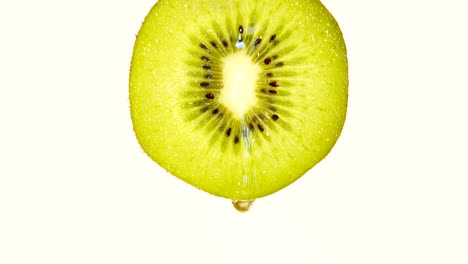 water or oils dropping on a kiwi