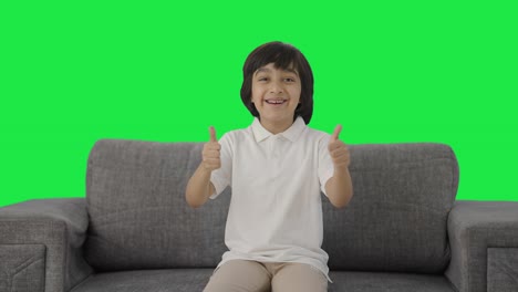 Indian-boy-showing-thumbs-up-to-the-camera-Green-screen