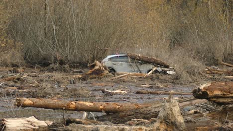 damaged area with car in a mudslide at agassiz, bc, canada - panning shot