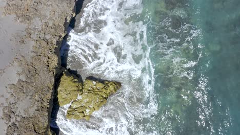 Aerial-topdown-ascent-of-beach-and-waves-in-Florida