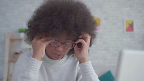 portrait tired and exhausted african american students woman with an afro hairstyle