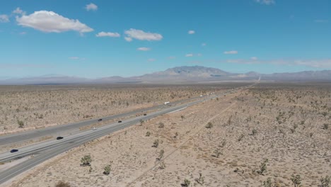 falling aerial of the highway leading from barstow, california to las vegas, nevada