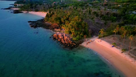 4K-Cinematic-nature-drone-footage-of-a-panoramic-aerial-view-of-the-beautiful-beaches-and-mountains-on-the-island-of-Koh-Lanta-in-Krabi,-South-Thailand,-during-sunset