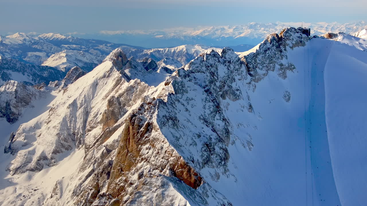 Aerial drone view of the Marmolada mountain in the Dolomites, northeastern Italy with the blue sky on the background