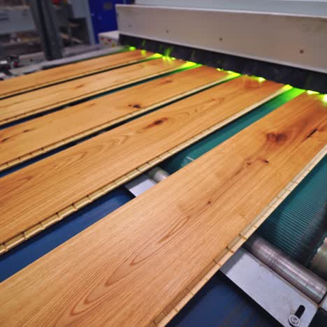 interior of furniture factory. production line of parquet board. modern industrial factory for laminated flooring.