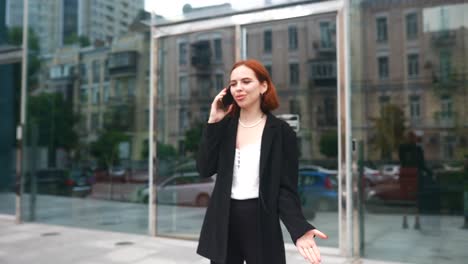 woman talking on phone in city