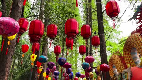 multi-coloured vibrant lanterns hang over path in people's park, chengdu, china