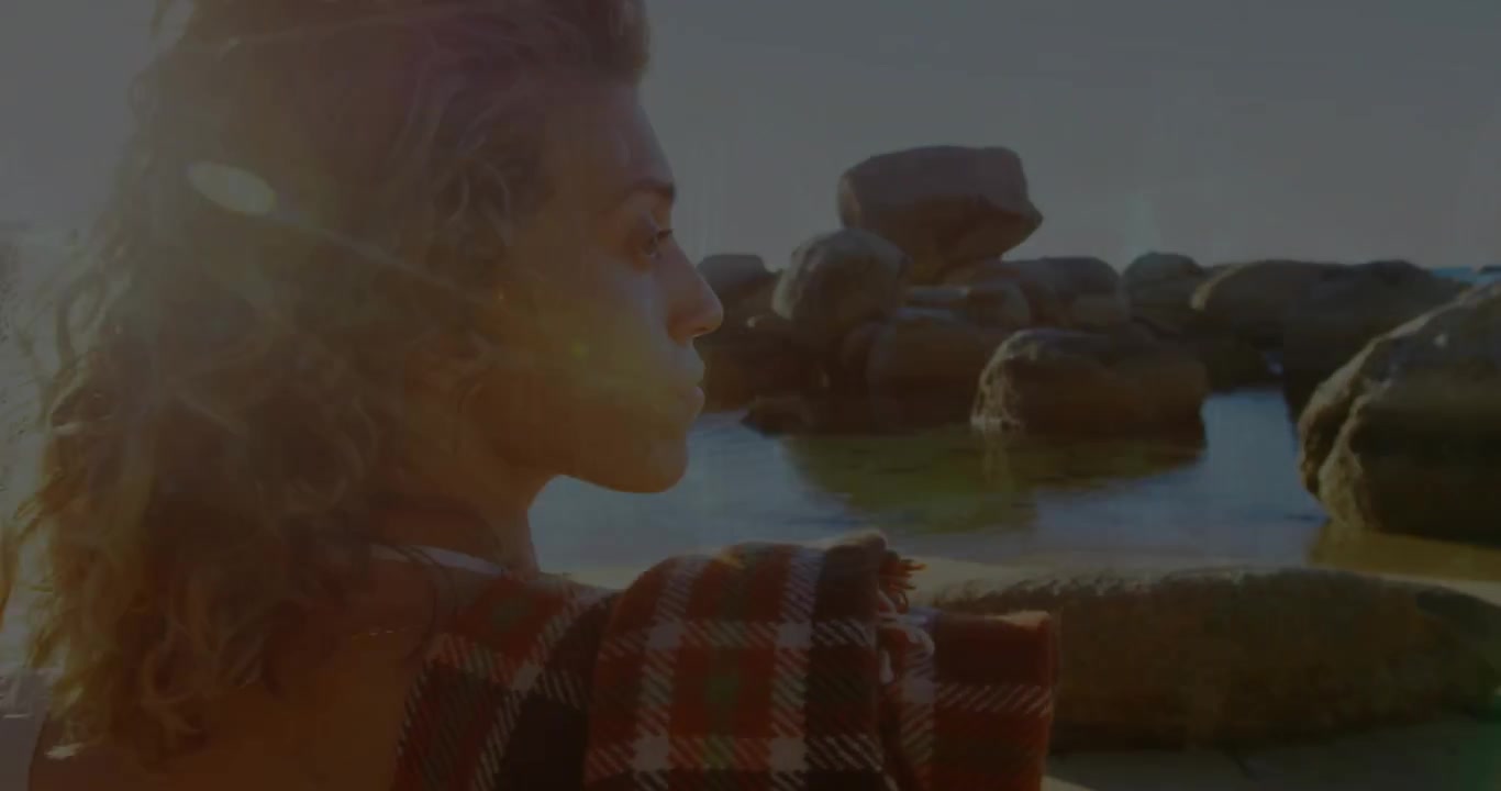 Vertical video: Woman turning toward sea, tech holo rising from sea crossing face revealing pools