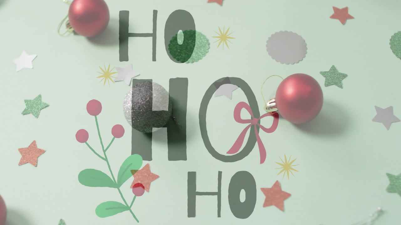 Decorazioni natalizie con animazione testuale "HO" su sfondo festivo