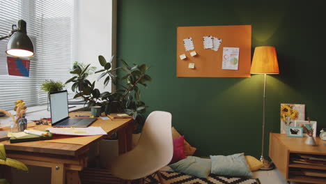 cozy home office with plants and warm colors