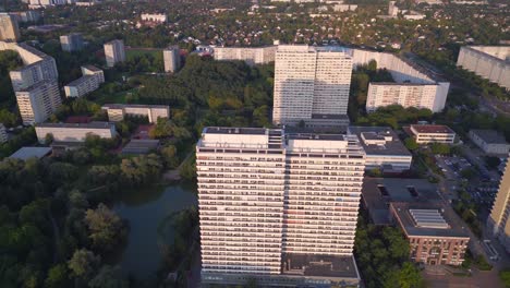 dramatic aerial top view flight panel system building, prefabricated housing complex, berlin marzahn east germany golden hour 2023