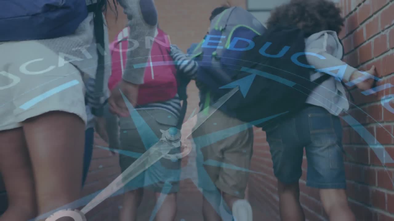Spinning compass against rear view of students with backpacks running at school