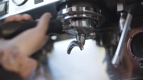 barista preps shot to be pulled