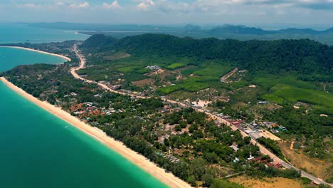 4K-Cinematic-nature-drone-footage-of-a-panoramic-aerial-view-of-the-beautiful-beaches-and-mountains-on-the-island-of-Koh-Lanta-in-Krabi,-South-Thailand,on-a-sunny-day