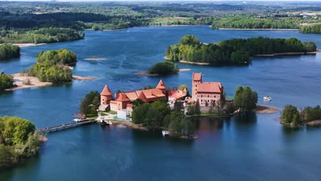 red brick castle of trakai, aerial orbit view