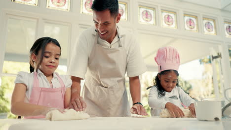 baking, dough and a dad teaching his girls