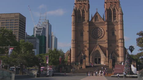 pan down sydney cathederal decorated during christmas time during the day in australia