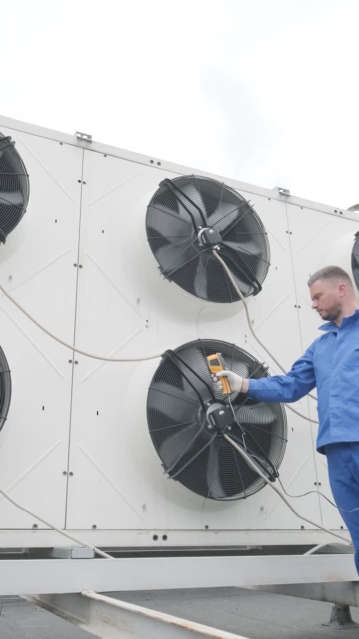 HVAC Technician Inspecting Air Conditioning Unit