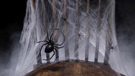 Halloween-horror-chair,-spider-web-and-fog-smoke-in-the-darkness