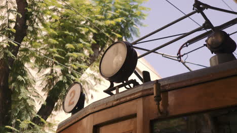 lights of old vintage wooden soller train in mallorca on a sunny day