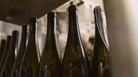 empty wine bottles in bottling process waiting to get filled with wine