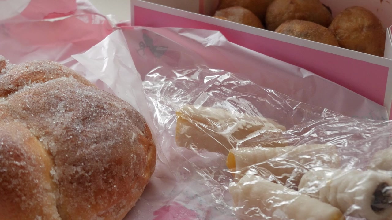 Pan de Muerto, buñuelos and Huesos de Santo. Traditional sweets from Mexico and Spain on Dia de los Muertos and All Saint´s Day respectively.