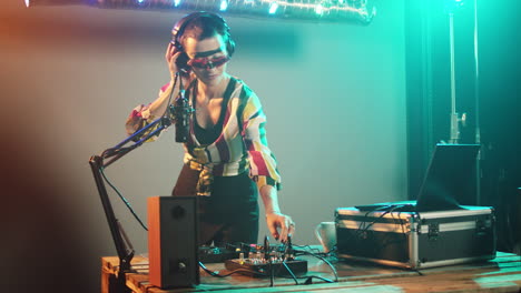 female performer using mixing turntables and buttons