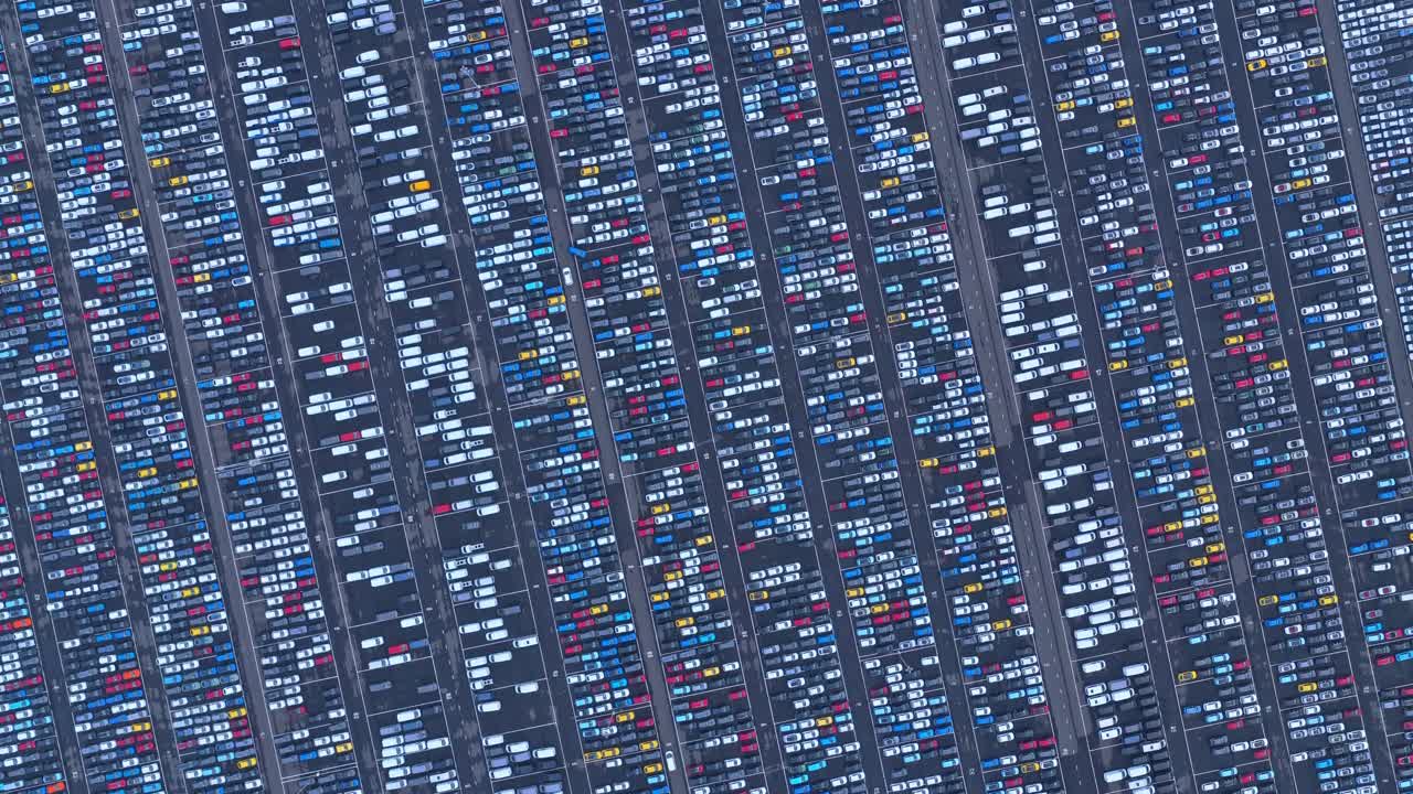 Aerial view of global auto hub with rows of parked vehicles, Netherlands