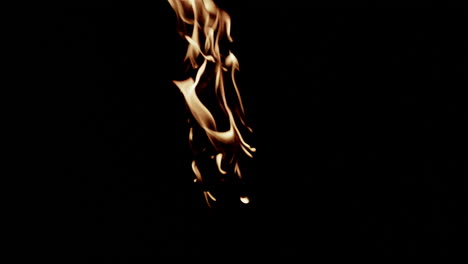 Slow motion flames in middle of screen burning while they move and flicker.