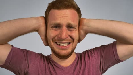 redhead male shows feeling awful music