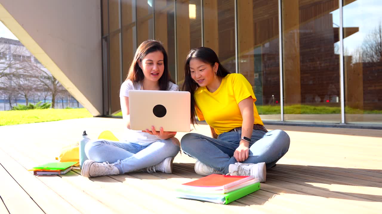 Two students studying together on campus