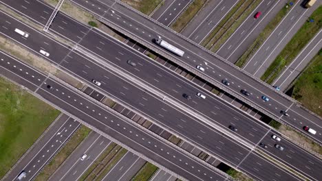 aerial view of freeway junction intersection voorst near apeldoorn in dutch landscape. infrastructure and urban transportation in the netherlands seen from above