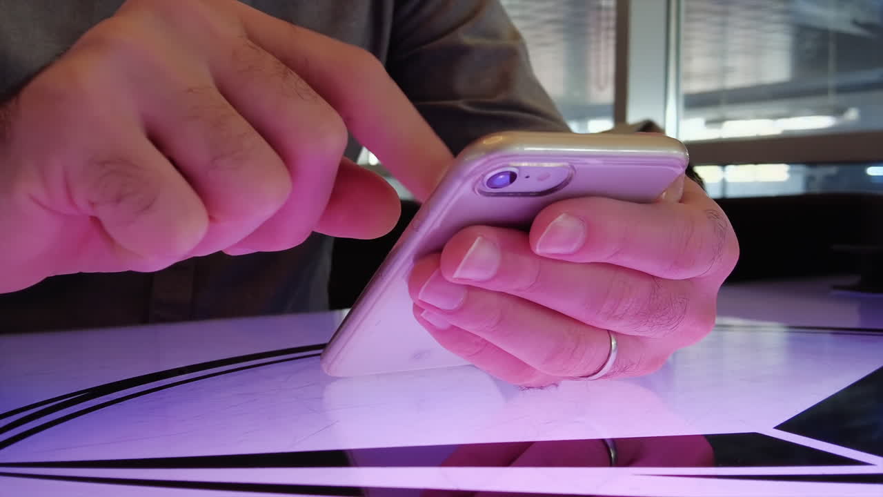 Man working on mobile phone at a restaurant