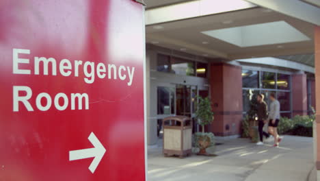 entrance of modern hospital building with signs shot on r3d