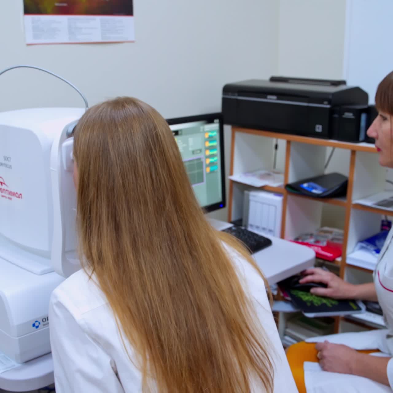 Optometrist working with patient