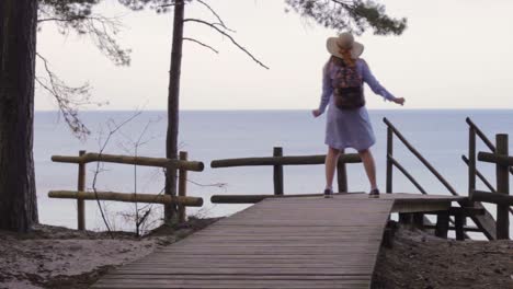 Charming-pretty-lady-letting-go-freely-dancing-on-deck-in-Sweden