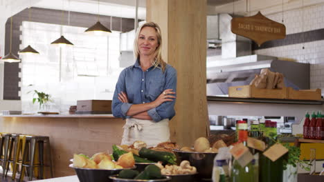 Portrait-Of-Female-Owner-In-Organic-Delicatessen