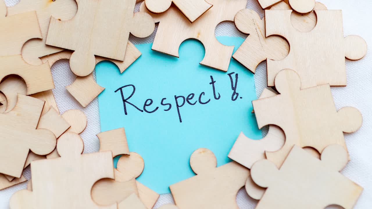 Explore the story of respect through a close-up of puzzle pieces symbolizing connection.