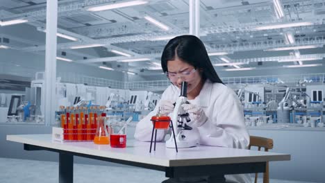 side view of asian woman scientist looking through a microscope then thinking, looking around, and raising index finger in the laboratory. working in the lab analyzing samples under microscope