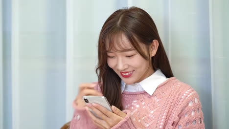 attractive young girls surfing internet or shopping online on a laptop computer sitting on the sofa at home