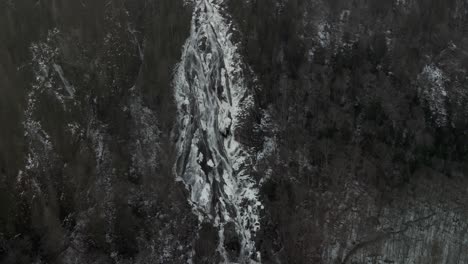 Scenic-View-Of-Ice-Waterfalls-Flowing-From-Hills-In-Vallee-Bras-du-Nord,-Saint-Raymond,-Canada-During-Winter-Season