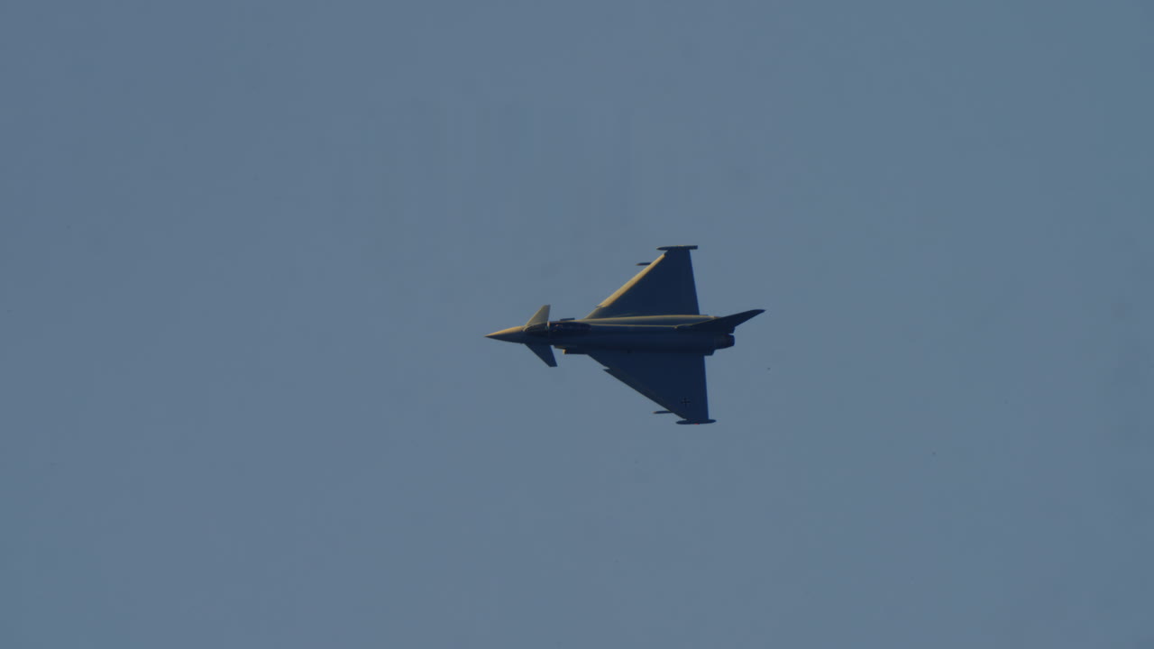 Eurofighter Typhoon Fighter Jet Flying Across a Clear Blue Sky