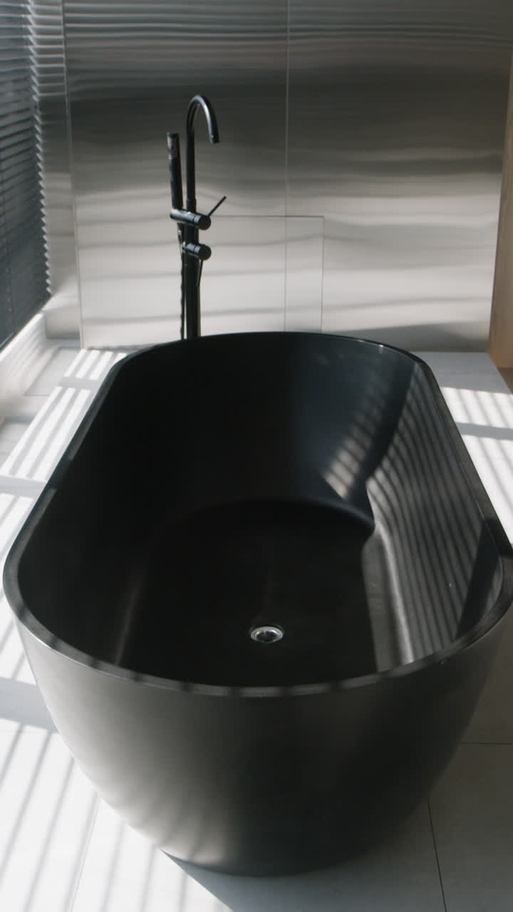 Modern Black Bathtub in a Minimalist Bathroom